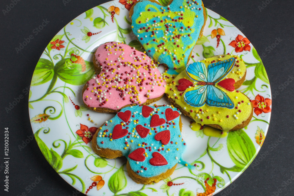 Valentine cookies in the shape of heart on black background Valentine cookies in the shape of heart on black background