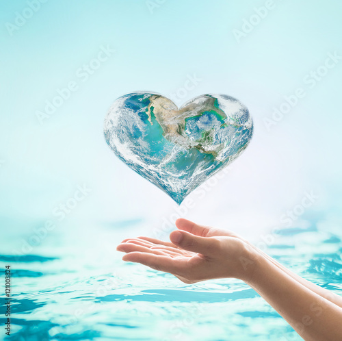 Woman female human hands on blurred wavy clean water background: Saving water clean natural environment ocean concept/ campaign: Love earth, save water conceptual idea/ sign