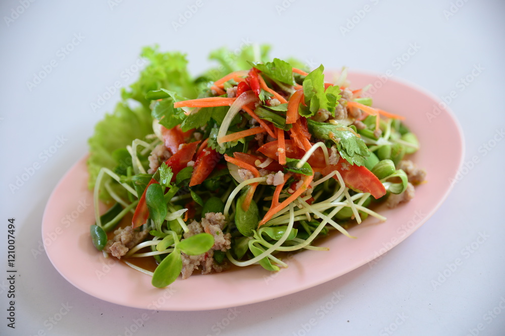 Special salad of minced beef, lectuce, cumin and herbs on white Special salad of minced beef, lectuce, cumin and herbs on white