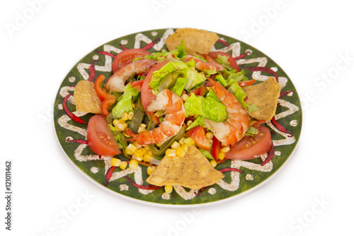 Mexican style of salads with shrimps, salmon, lemon and lettuce