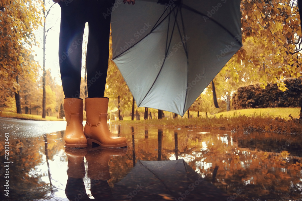 feet in rubber boots rain puddle city Stock Photo | Adobe Stock