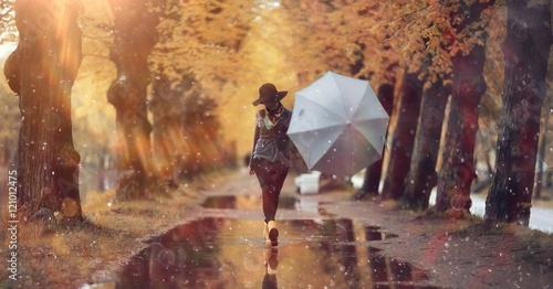 autumn landscape city woman umbrella rain puddles of yellow trees