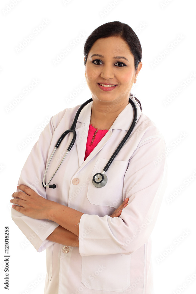 Young female doctor with arms crossed against white background Young female doctor with arms crossed against white background