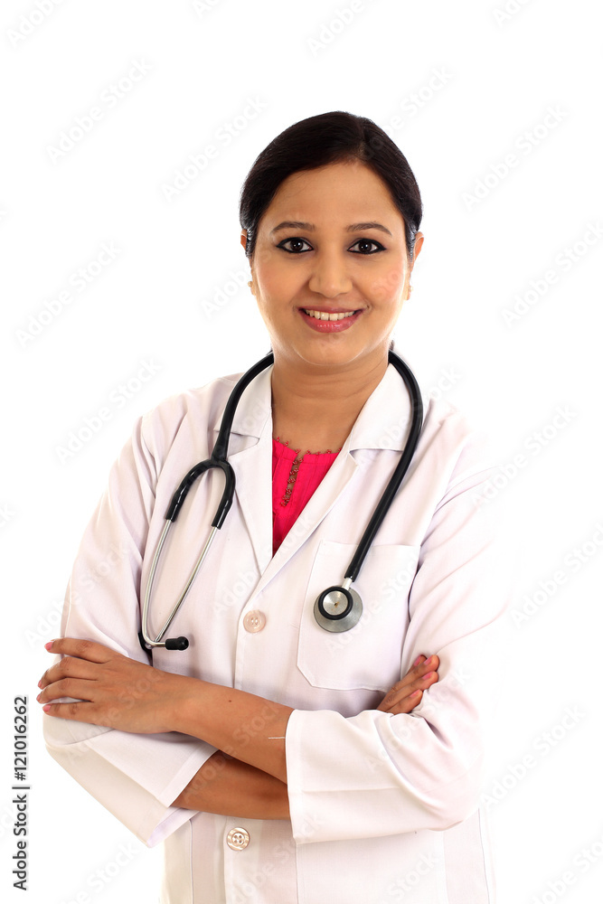 Young female doctor with arms crossed against white background Young female doctor with arms crossed against white background