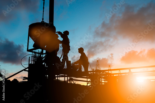 Silhouette People Heavy Construction workers working on scaffold photo