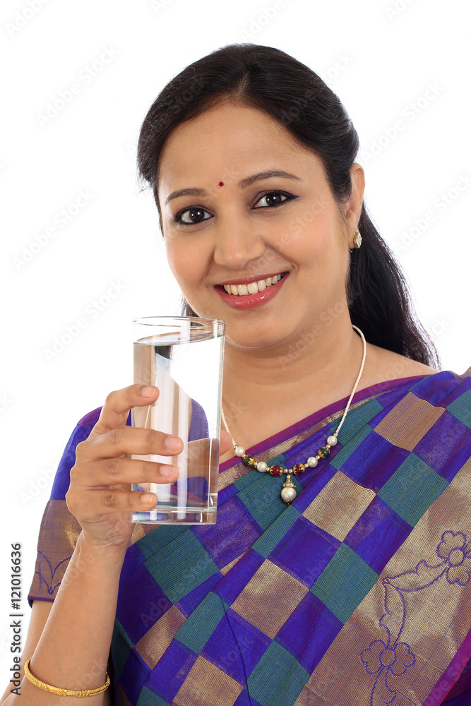 Happ young traditional woman drinking glass of water Happ young traditional woman drinking glass of water