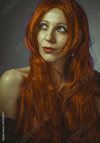 attractive woman with huge red mane  blue chroma