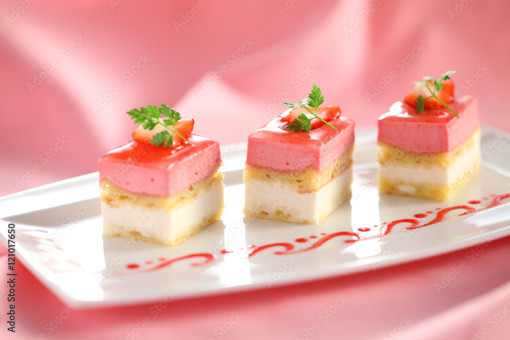 Pudding cake with mint leaves and strawberry on white plate with Pudding cake with mint leaves and strawberry on white plate with