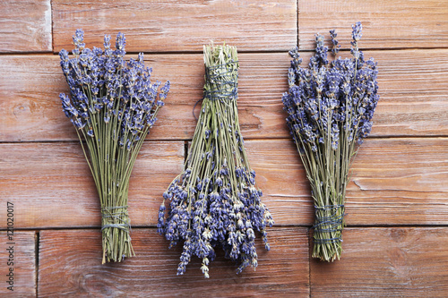 Bunch of lavender flowers on brown wooden background