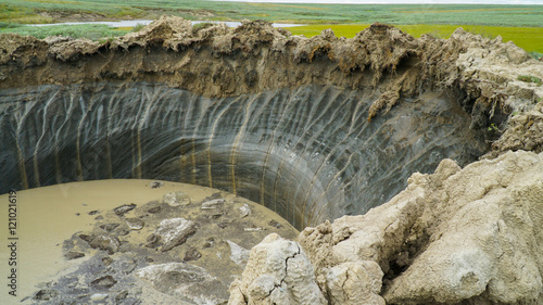 YAMAL PENINSULA, RUSSIA - JUNE 18, 2015: Expedition to the giant funnel of unknown origin. Crater view. photo