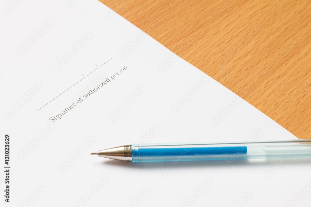 Pen on paper with Signature of authorized person wording Pen on paper with Signature of authorized person wording