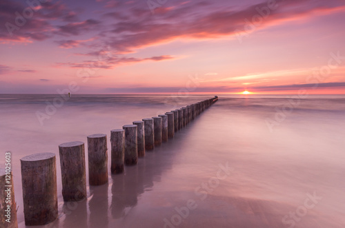 Wooden breakwater - Baltic seascape at sunset, Poland