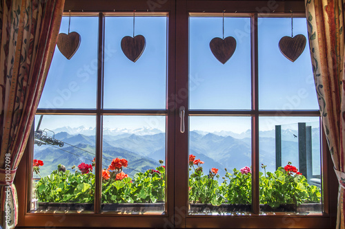 Window of alpine cottage, Tirol, Austria. View from inside. photo