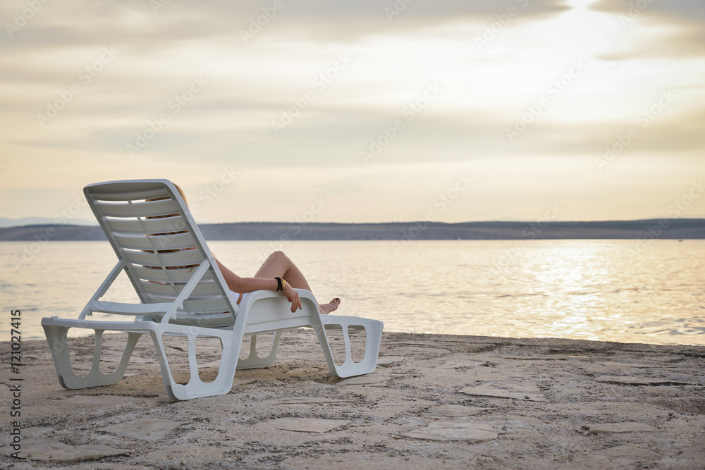 Relax on sunbeds on peaceful beach, holiday and vacation Relax on sunbeds on peaceful beach, holiday and vacation