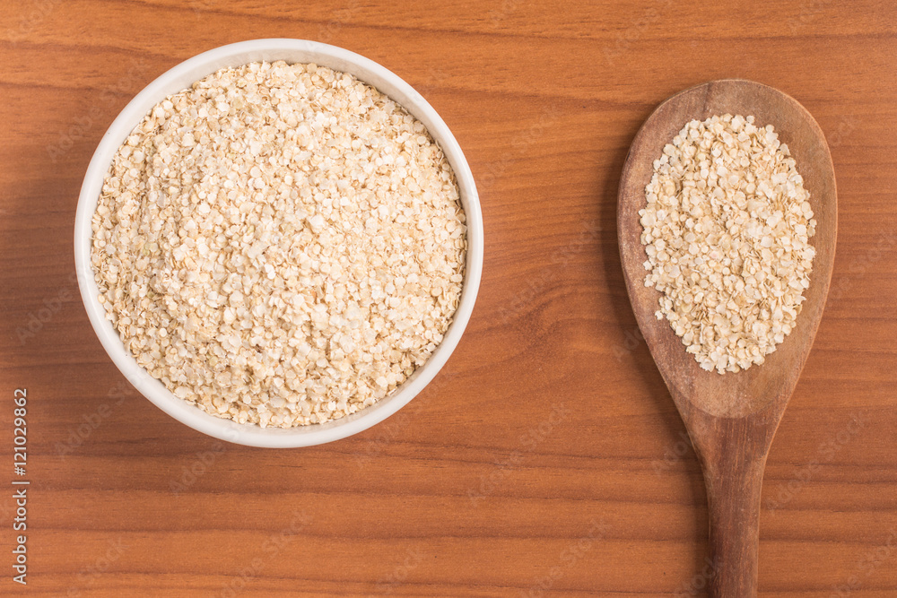 Quinoa Flakes into a bowl. Super Food. Quinoa Flakes into a bowl. Super Food.