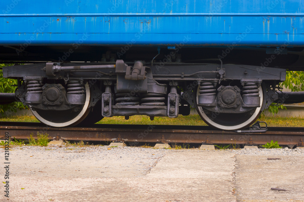 Train Wheels on Railroad. Detail of  Rustic Blue Wagon