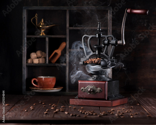 Still life vintage coffee grinder and coffee beans © Rozmarina