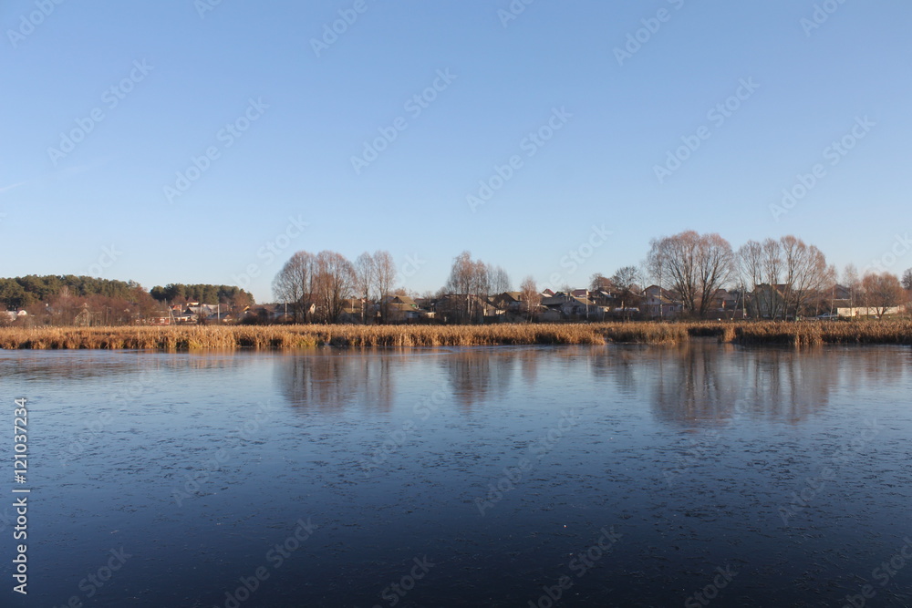 Fototapeta premium autumn landscape. the lake in the village