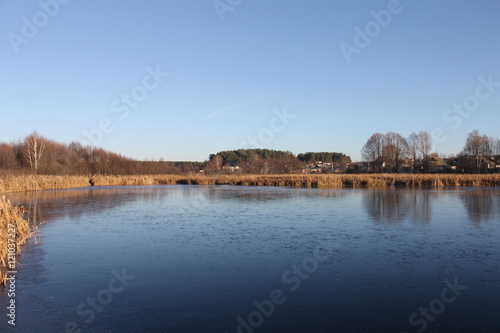 autumn landscape. the lake in the village