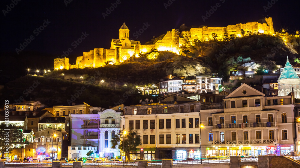 Fototapeta premium Aerial night view of Old Tbilisi, Georgia with Illuminated churc