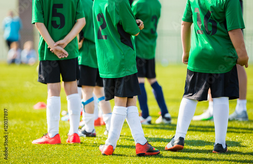 Reserve Soccer Players on a Team Bench. Teenagers Boys Playing Soccer Football Match. Soccer Players Waiting On Bench 