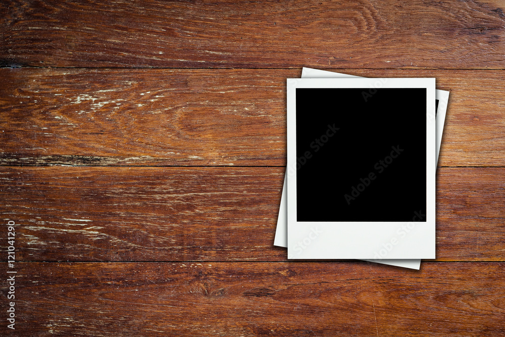 Blank frame photo on wood background with space. Blank frame photo on wood background with space.