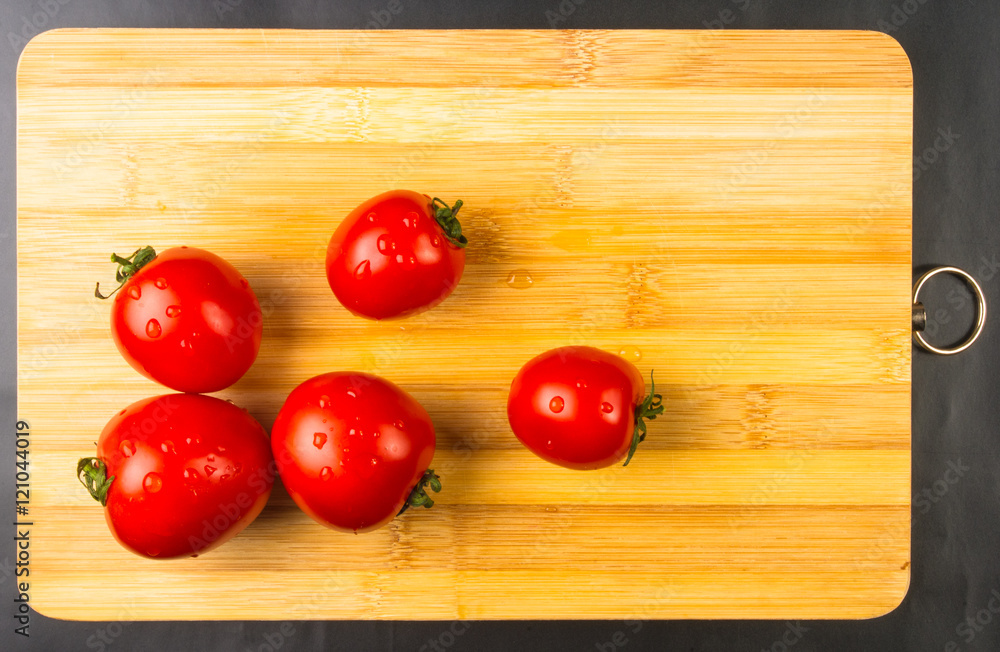 tomatoes on wooden background tomatoes on wooden background