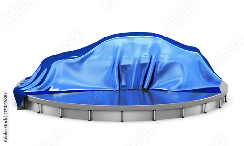Car on the podium covered with a blue satin cloth before present