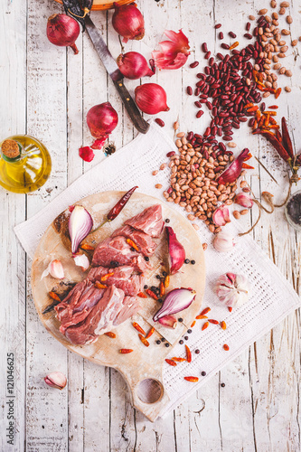 Butcher beef sliced meat with black and red dried beans and variety spiced and vegetables