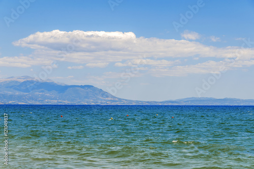 Sea background close with cloudy sky