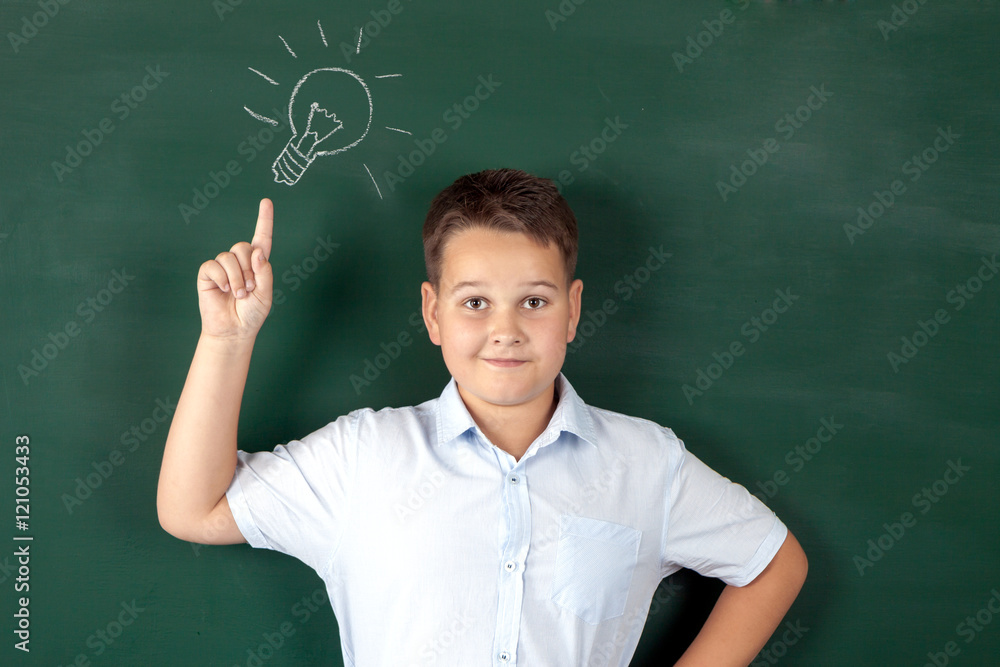 boy in a shirt with school boards