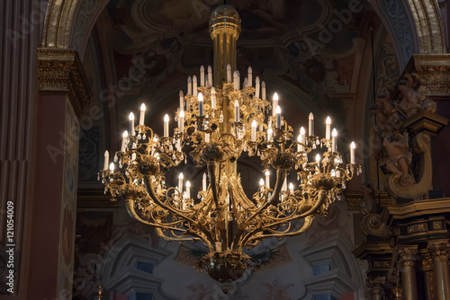 Crystal chandelier lighting in the church photo