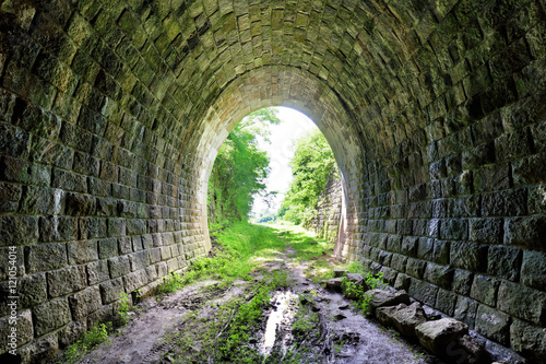 Long underground brick tunnel photo