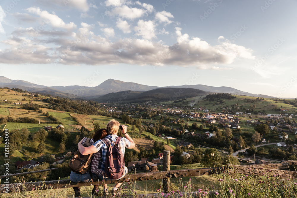 man and woman traveling in the mountains man and woman traveling in the mountains