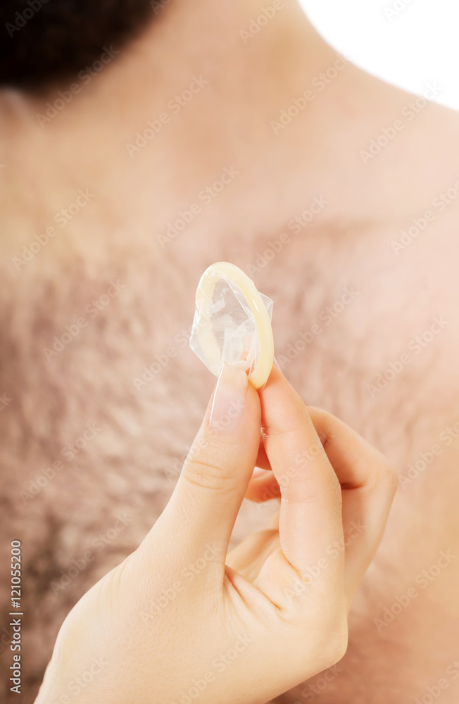 Couple with a condom. Couple with a condom.