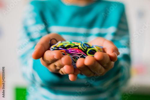 Wallpaper Mural Child holding loom bands Torontodigital.ca