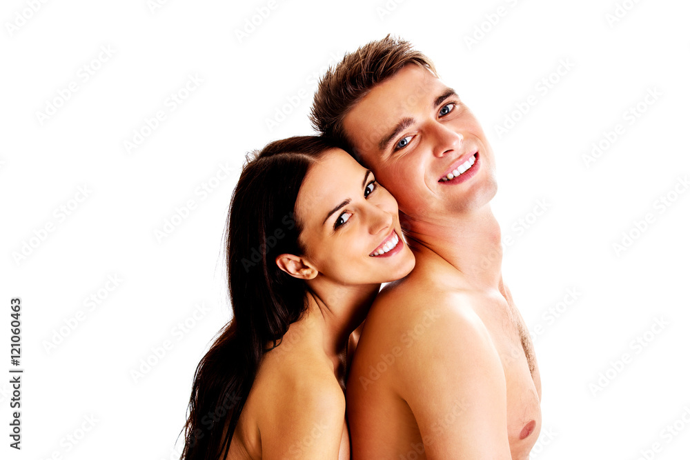 Happy couple hugging and laughing together Happy couple hugging and laughing together