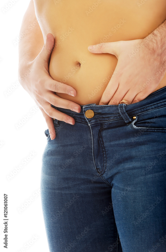 Naklejka premium Man touching silm woman's belly.