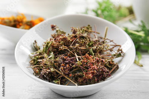 Natural flower and herb selection in ceramic bowl  close up