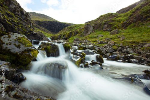 Waterfall. Water running over rocks. Iceland.
