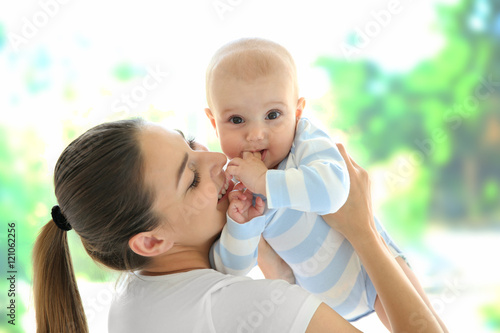 Mother and baby on light ba...