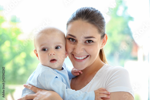 Mother and baby on light ba...