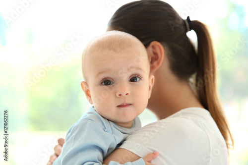 Mother and baby on light ba...