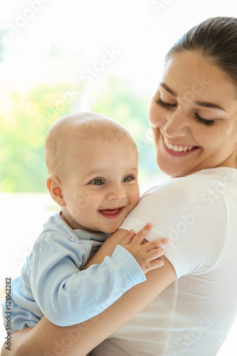 Mother and baby on light ba...