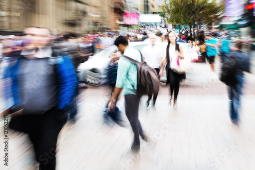 crowd of people crossing a street with zoom effect