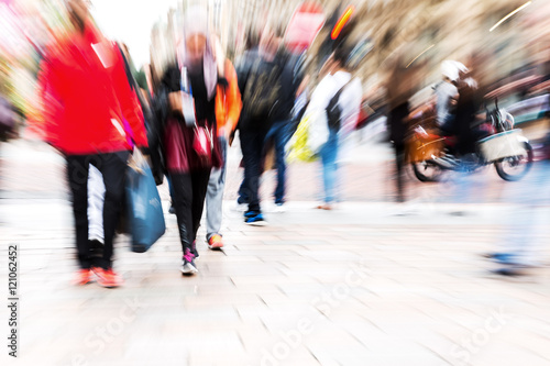 crowd of people crossing a street with zoom effect