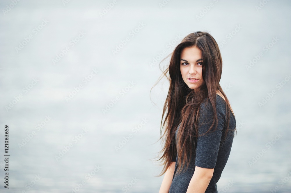 Portrait of beautiful brown-eyed girl with long, tangled from th Portrait of beautiful brown-eyed girl with long, tangled from th