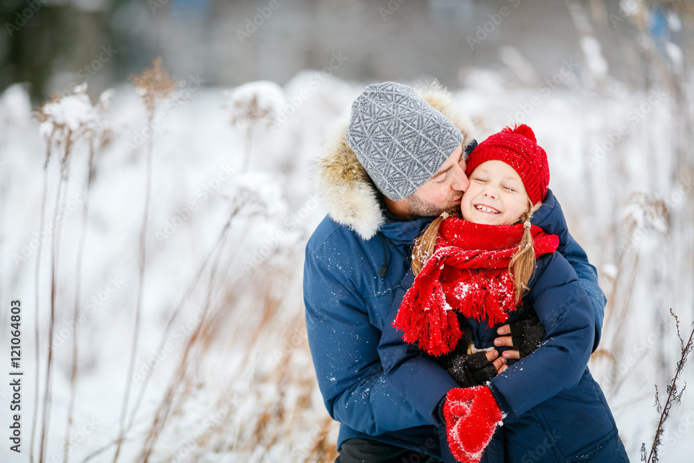 Father and daughter outdoors at winter Father and daughter outdoors at winter