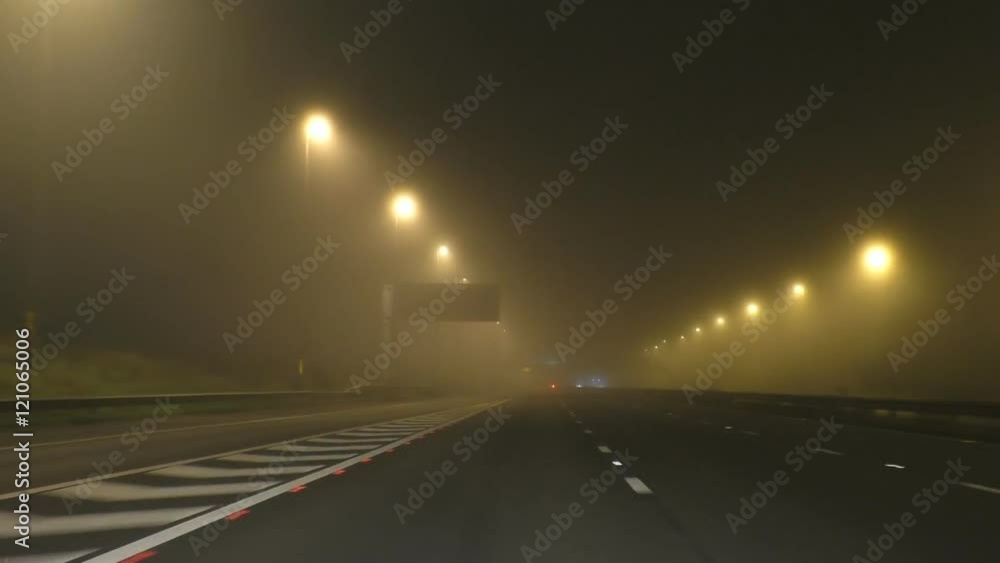 Driver's point of view pov while traveling travelling on the left hand side of motorway in fog at night in the rural area of England, United Kingdom Driver's point of view pov while traveling travelling on the left hand side of motorway in fog at night in the rural area of England, United Kingdom