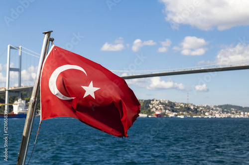Turkish flag view from Bosphorus, with sea and bridge